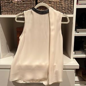 Cream sleeveless blouse